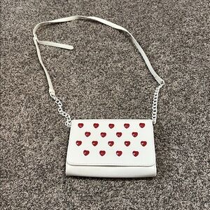 Betsey Johnson heart studded crossbody bag in white synthetic material.